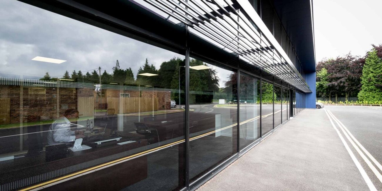full height glazing to a double height office frontage with solar shading Brise soleil