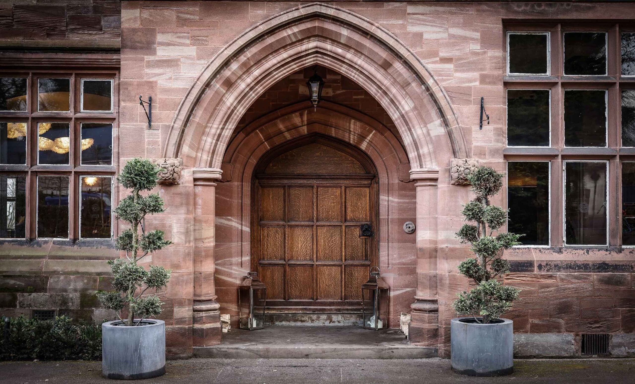 standon hall main entrance door with heritage original hardwood timber and solid red stone walls